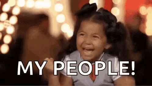 a little girl is crying and screaming while holding her fist in the air .