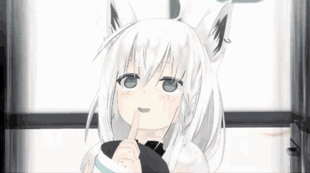a girl with white hair and green eyes is holding her finger to her lips