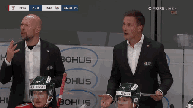 a hockey game is being played and the score is 2-0