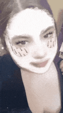 a woman with a mask on her face has the word beauty on her face