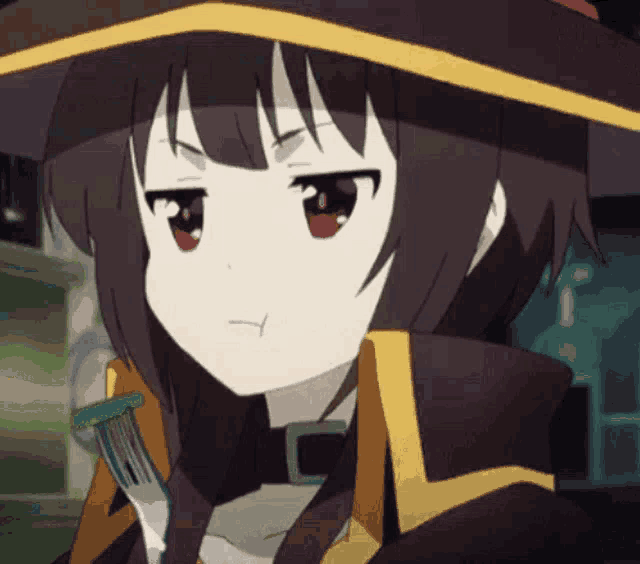 a girl is holding a fork in her hand and making a funny face