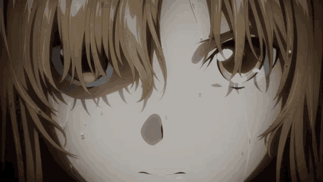 a close up of a person 's face with tears running down their face