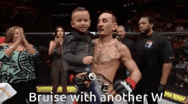a man is holding a child in his arms with the words bruise with another w on the bottom right