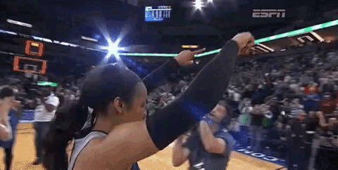a basketball game is being played in a stadium sponsored by espn