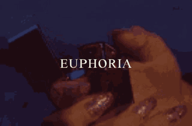 a person lighting a lighter with the word euphoria written below it