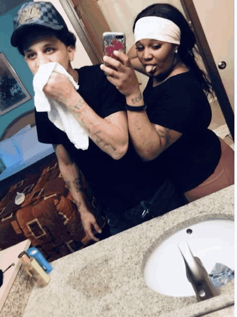 a man and a woman are taking a selfie together