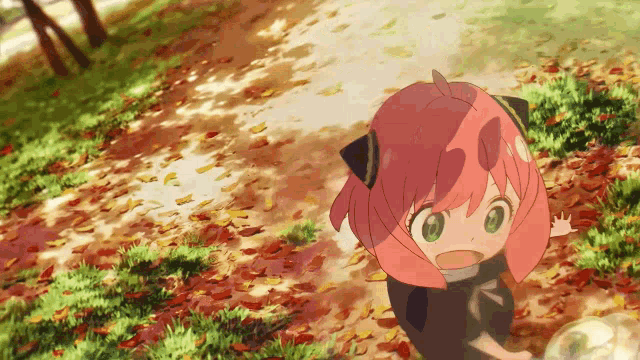 a girl with pink hair and green eyes is standing in a park