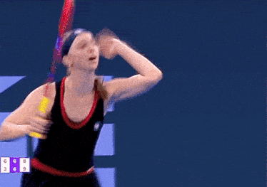 a woman with a headband on looks down with the number 6 and 9 in the corner