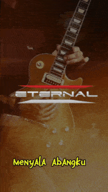 a person playing a guitar with the words eternal written above them