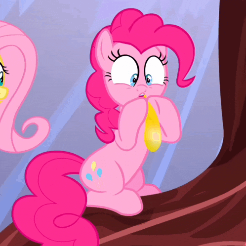 pinkie pie from my little pony is holding a yellow balloon in her mouth
