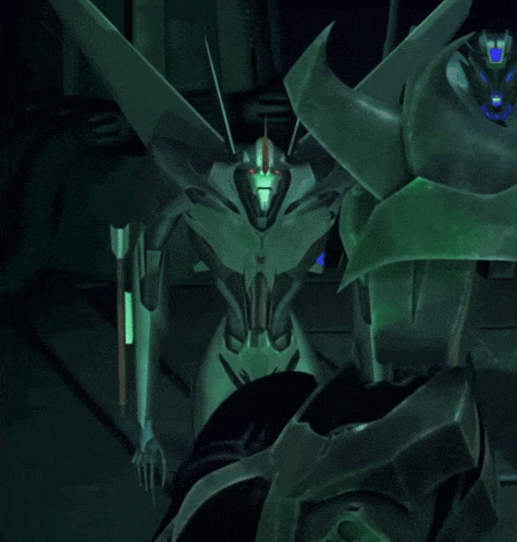 a close up of a green robot with glowing eyes