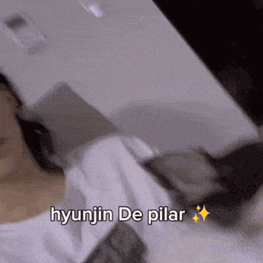 a blurred image of a person with the words hyunjin de pilar written on it