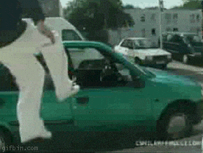 a green car with a gifbin.com watermark on the bottom