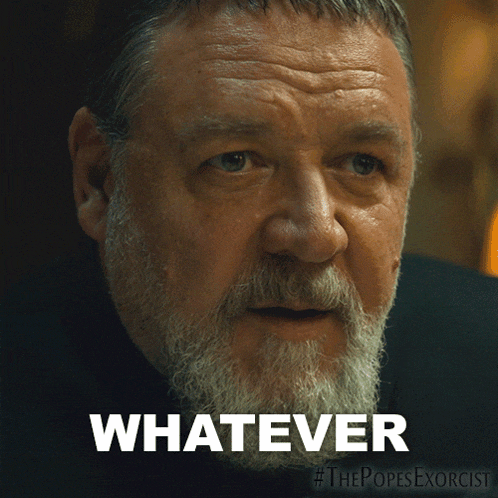 a man with a beard says " whatever " on a poster