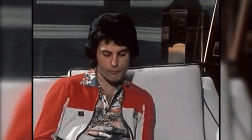 Freddie Mercury Scratch Mouth GIF - Freddie Mercury Scratch Mouth Bored GIFs