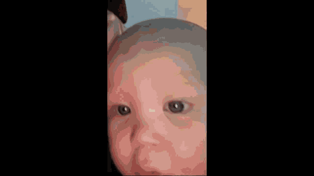 a close up of a baby 's face with the words missa siili vauva on written above it
