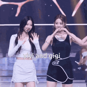 a couple of girls standing next to each other with the words yiyi and gigi written on the bottom