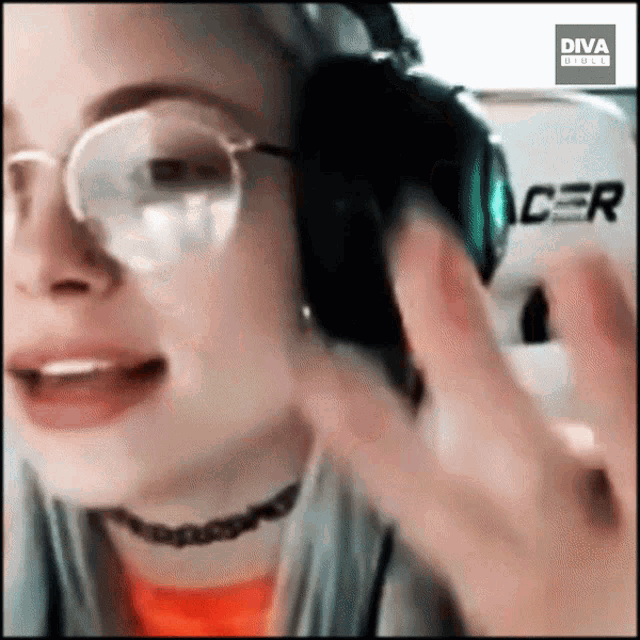 a woman wearing glasses and headphones with the diva group logo on the bottom