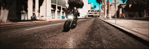 a man is riding a motorcycle down a street