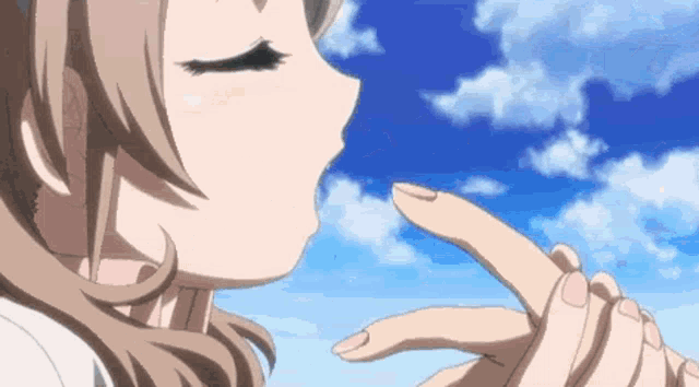 a girl blowing a kiss with her eyes closed and a blue sky in the background