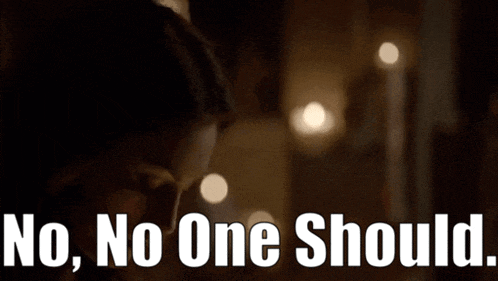 a woman in a dark room with the words " no no one should " below her