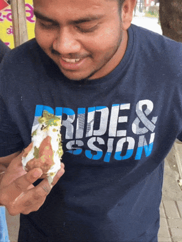a man wearing a shirt that says ride and passion