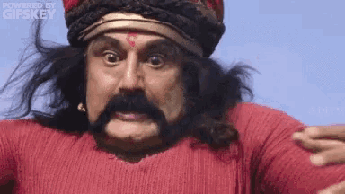 a man with a mustache and a red sweater is powered by gifkey