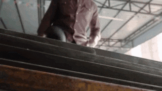 a man is walking up a set of stairs .