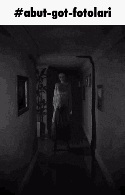 a black and white photo of a ghost in a hallway with the hashtag #abut-got-fotolari