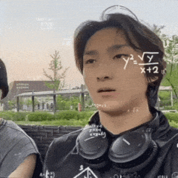 a man wearing headphones has a mathematical formula drawn on his face