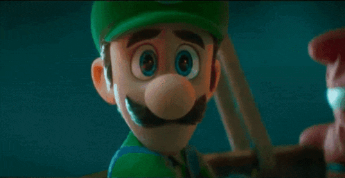 a close up of a cartoon character wearing a green hat and a green shirt .