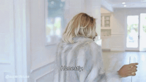 a woman in a fur coat is holding a wine glass and saying this is me .
