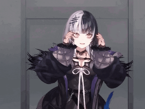 a girl with a cross on her forehead is wearing a black coat