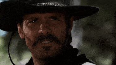a man with a cowboy hat says i was just foolin ' about