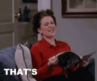 a woman is sitting on a couch reading a magazine and the word that 's is on the screen .