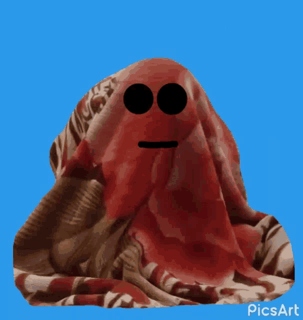 a red blanket with a smiling face and the word yes on it