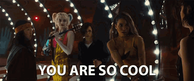 a group of women standing next to each other with the words you are so cool