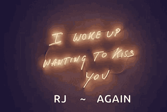 a neon sign says i woke up wanting to kiss you