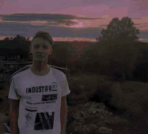 a man wearing a t-shirt that says ' imo total ' on it