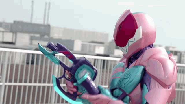 a person in a pink helmet holding a purple gun
