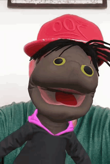 a person with a puppet on their face wearing a red hat with the number 007 on it