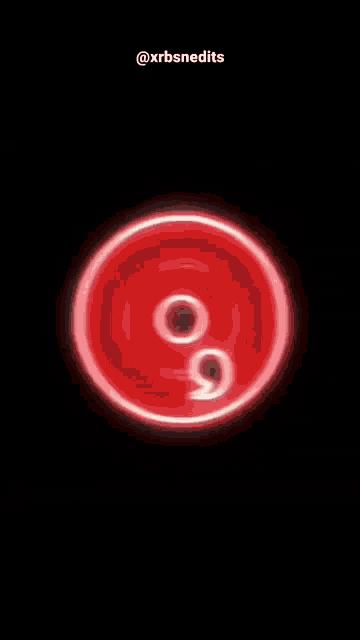 a red spiral in the middle of a black background .