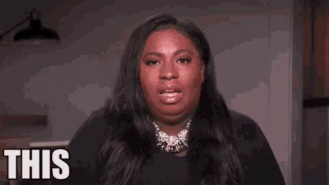 a woman is saying `` this is the '' while making a funny face .