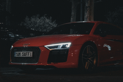 a red sports car with a license plate that says 1am saff1