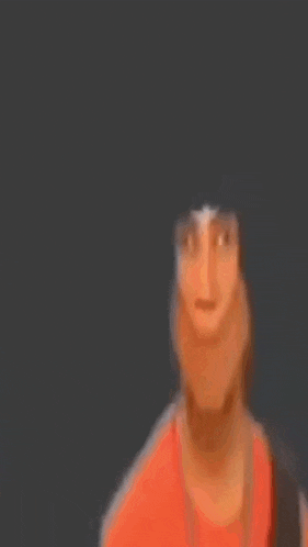 a blurry picture of a person holding a stick and pointing at the camera .