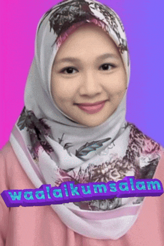 a woman wearing a hijab and a pink shirt with the words waalaikumsalam written on the bottom