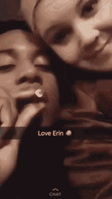 a woman is kissing a man 's forehead with the words love erin written on the bottom