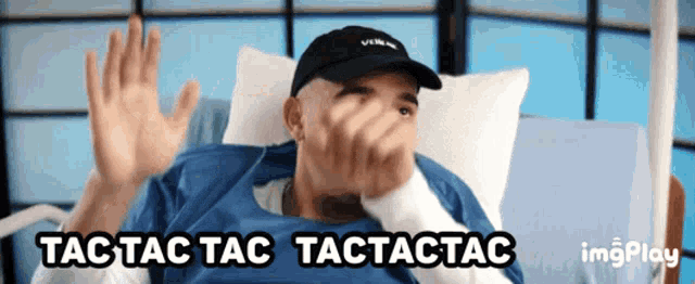 a man laying in a hospital bed with the words tic tac tac written on the bottom