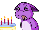 a purple cartoon character is standing next to a birthday cake with candles on it