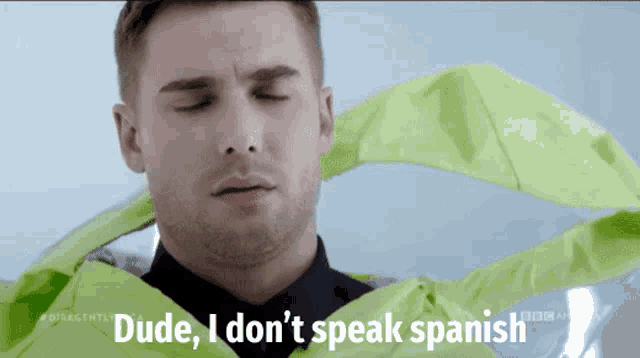 a man says dude i don 't speak spanish in front of a green cloth
